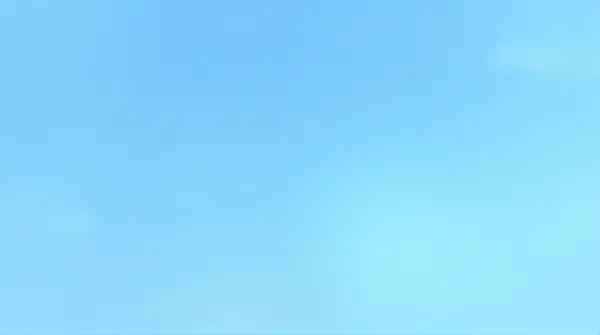 Low-angle view of a clear blue sky with soft, thin clouds showing gradient shades of blue.