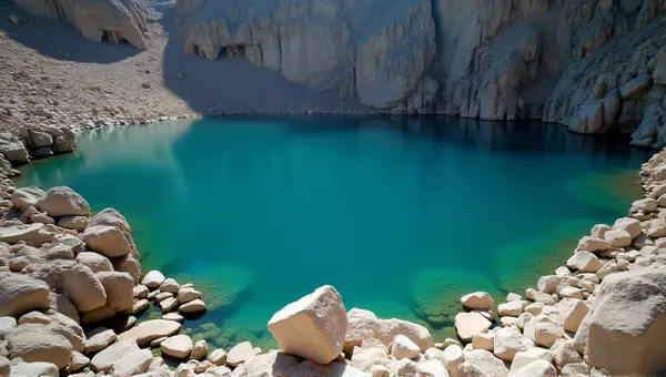 Clear Lake Surface Near Jagged Rock Shoreline