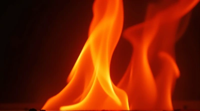 Close-Up Dynamic Flame Flickering Against Dark