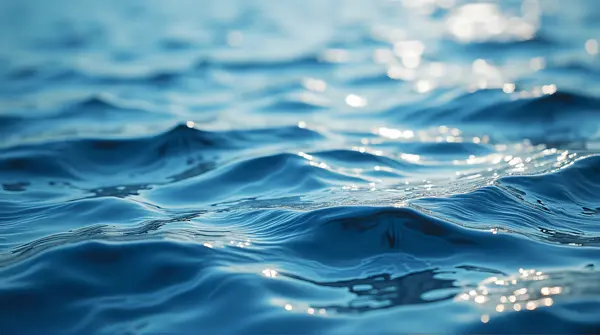 Close-up showing detailed fluid patterns and flowing contours with light highlights and soft motion