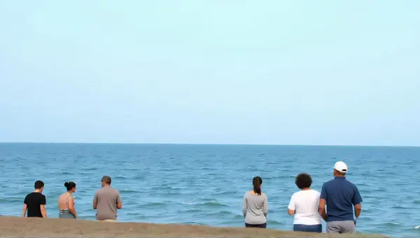 Coastal Gathering With Ocean View And Clear Sky