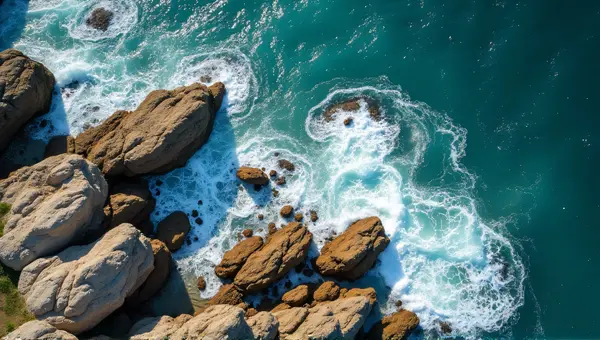 Coastal Rocks And Foam Patterns From Above