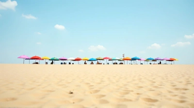 Colorful Parasols Along Golden Coastline Clear Sky