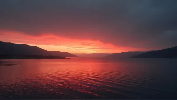Crimson Sky Above Quiet Lakeside Scene