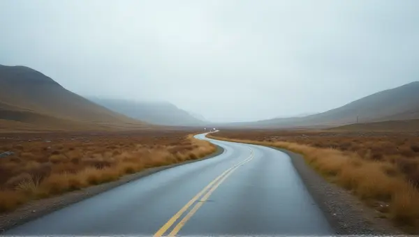 Curved Pathway With Hills Under Cloudy Sky