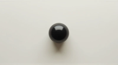Dark Orb On Pale Surface Top View