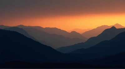 Dark Ridges Against Glowing Amber Sky Contrast
