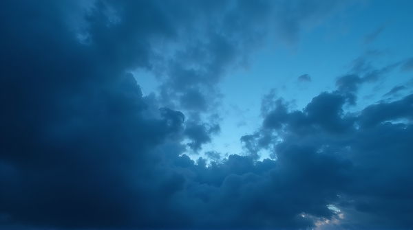 Layered deep sapphire vapor masses create dense textured patterns in the sky from a low angle view.