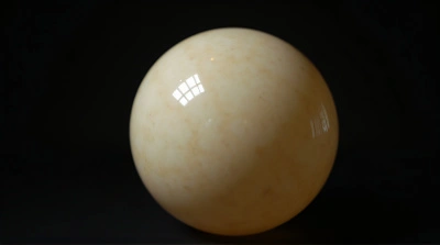 Detailed Pale Orb Surface Close-Up Against Dark Background