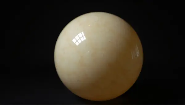 Detailed Pale Orb Surface Close-Up Against Dark Background
