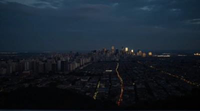 Distant Skyline At Dusk With Lit Buildings