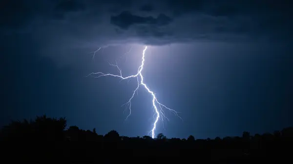 Electric Lightning Bolt Illuminating Twilight Landscape