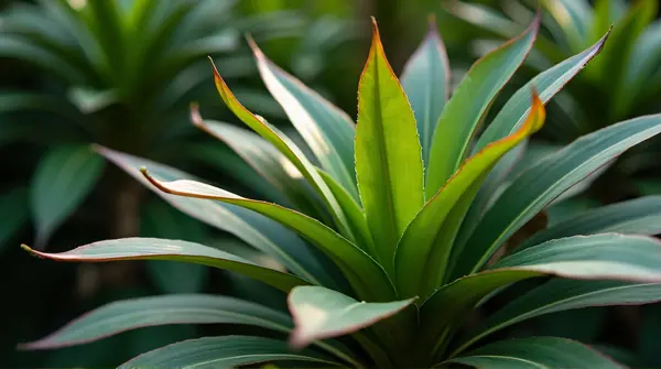 Cluster of emerald and chestnut leaves with soft lighting highlighting overlapping shapes and patterns