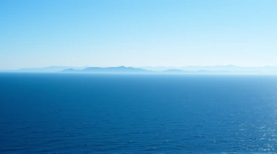 Expansive Deep Blue Sea Near Mountain Range