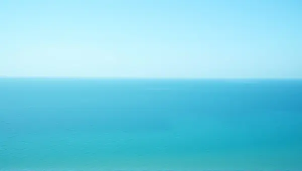 Expansive Deep Sea Horizon Under Clear Sky