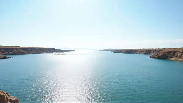 Expansive Shimmering Ocean Horizon With Rocky Outcrops