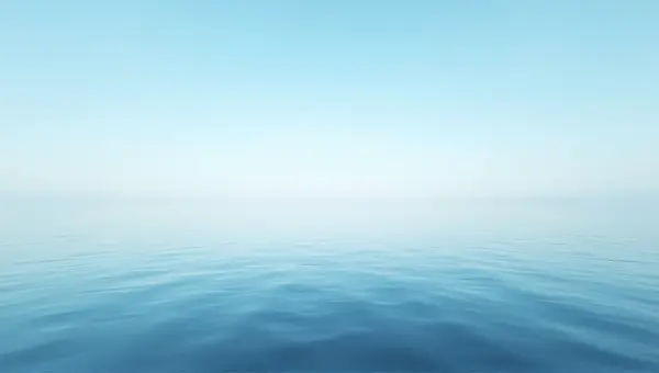 Expansive Still Water Under Clear Blue Sky
