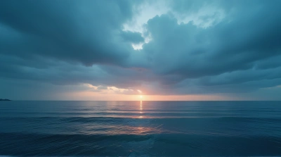 Expansive Water Surface Under Moody Twilight Sky