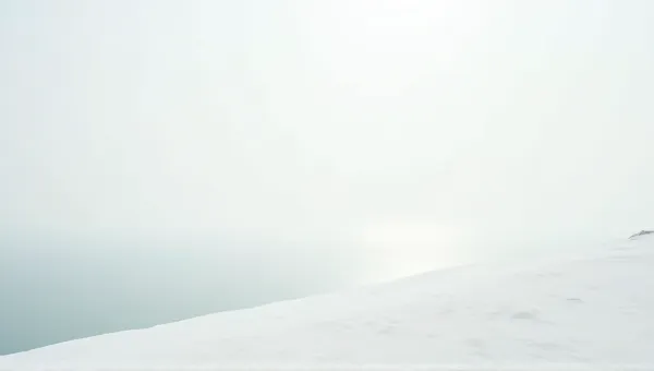 Expansive White Terrain Beside Shimmering Lake