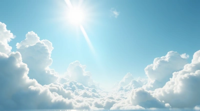 Fluffy White Clouds Over Sunlit Terrain