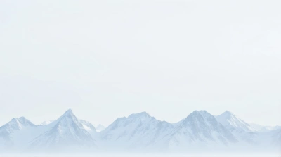 Frosted Mountain Peaks Under Pale Sky Horizon