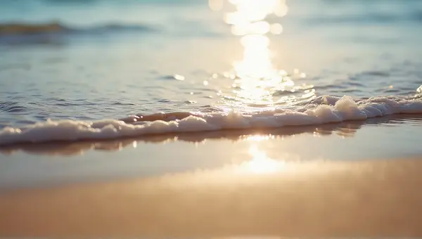 Gentle Water Waves Washing Over Smooth Sand