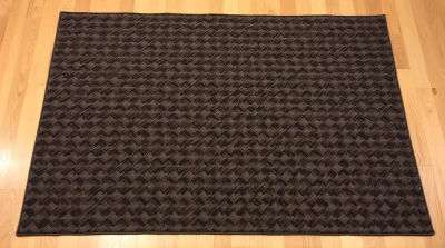 Geometric Patterned Rug On Oak Hardwood Floor