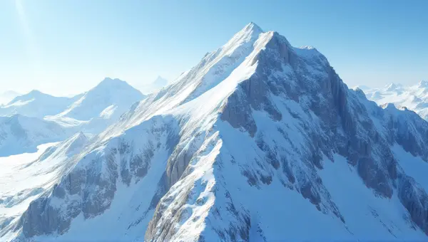 Glacier-Covered Rocky Summit With Crevasses