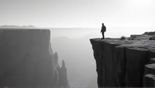 Grayscale Portrait On Jagged Rock Formation