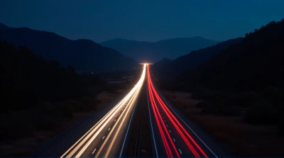 Highway Light Trails On Dark Landscape