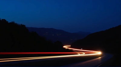 Highway Light Trails Under Indigo Sky