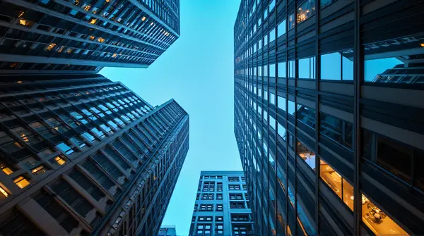 Illuminated Skyscrapers Reflecting Evening Lights