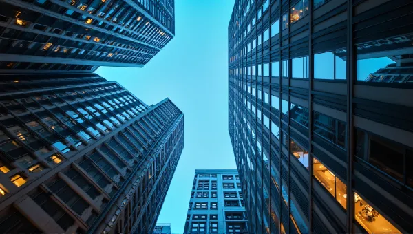 Illuminated Skyscrapers Reflecting Evening Lights