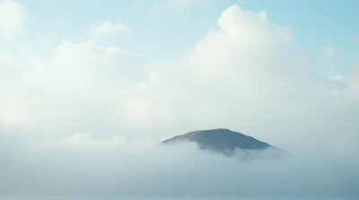Isolated Island Under Fluffy White Clouds Daylight
