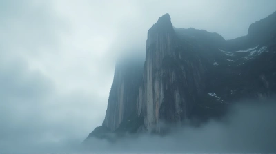 Jagged Escarpment Against Gray Vapor Sky