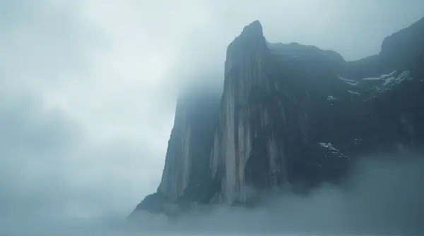 Jagged Escarpment Against Gray Vapor Sky