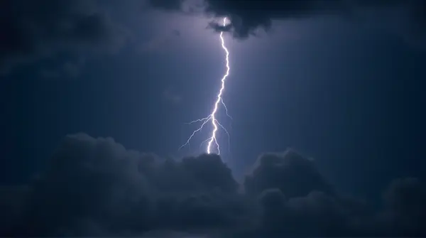 Jagged Lightning Bolt Striking Dark Sky