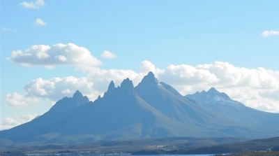 Jagged Mountain Range With Bright Sky Horizon