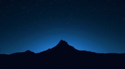 Jagged Mountain Ridge Silhouette Under Starry Night Sky