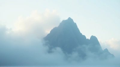 Jagged Peak With Misty Vapor Formations