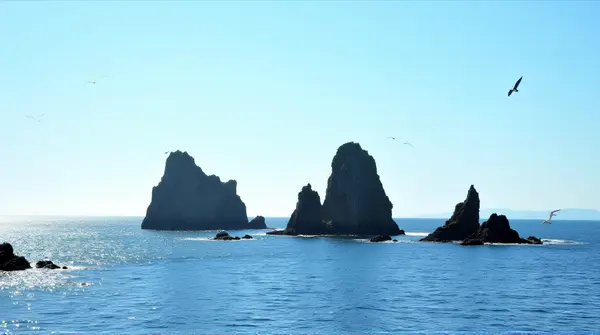 Jagged Rocky Islands Amid Shimmering Water
