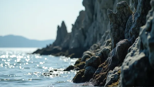 Jagged Stone Cliffs Rising Along Shimmering Lake