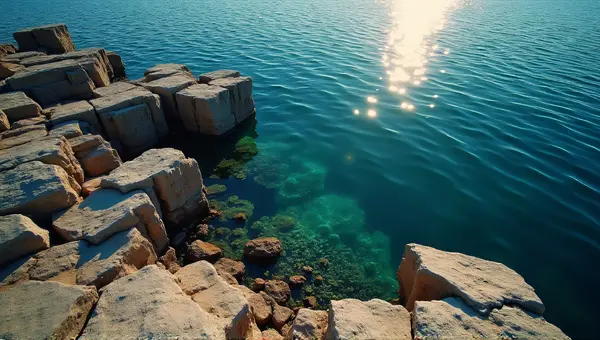 Jagged Stone Structures By Shimmering Lake Surface