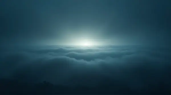 Wide-angle view of layered mist glowing against a dark sky, highlighting depth and texture with light and shadow contrast.