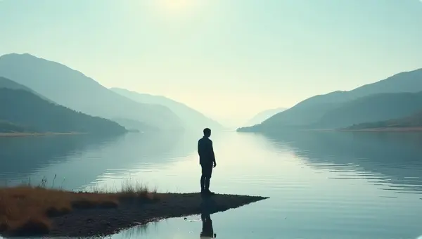 Man Contemplating Quiet Riverbank Reflection
