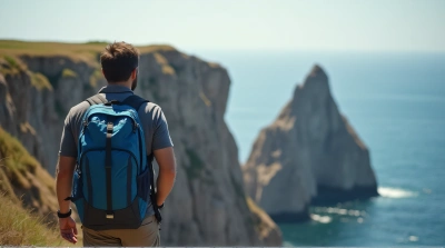 Man Hiking Near Jagged Cliffs Under Bright Sunlight