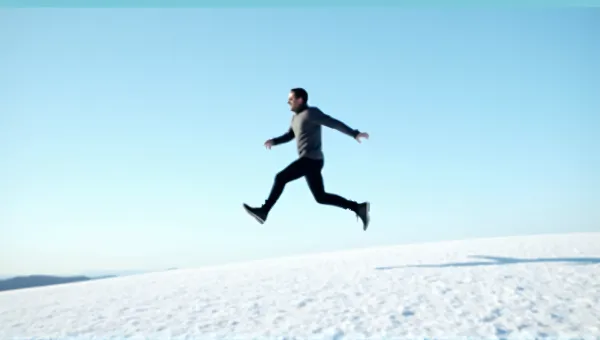 Man Leaping Across Frosty Field Under Clear Sky