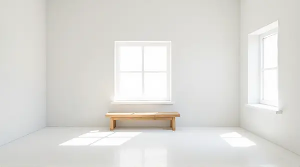 Minimalist White Room With Natural Light And Wooden Bench