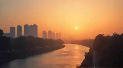 Modern Buildings Silhouetted By Amber Horizon