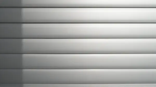 Close-up of monochrome fabric with narrow and wide horizontal linear bands under soft natural light